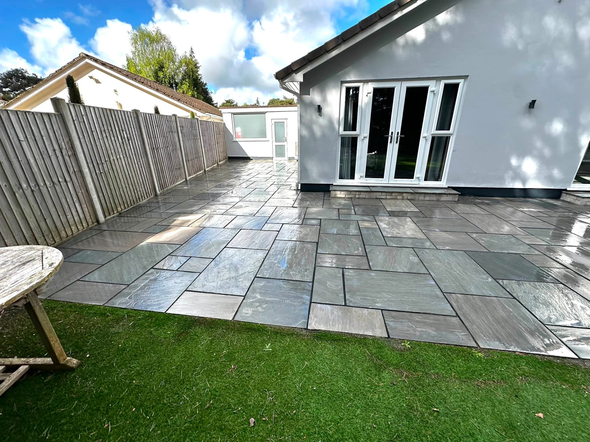 Grey riven slate patio cleaned by Dorset Exterior Cleaning